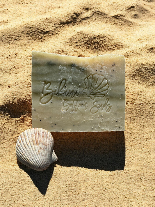 Organic oil-based soap bar with light exfoliation and earthy scent